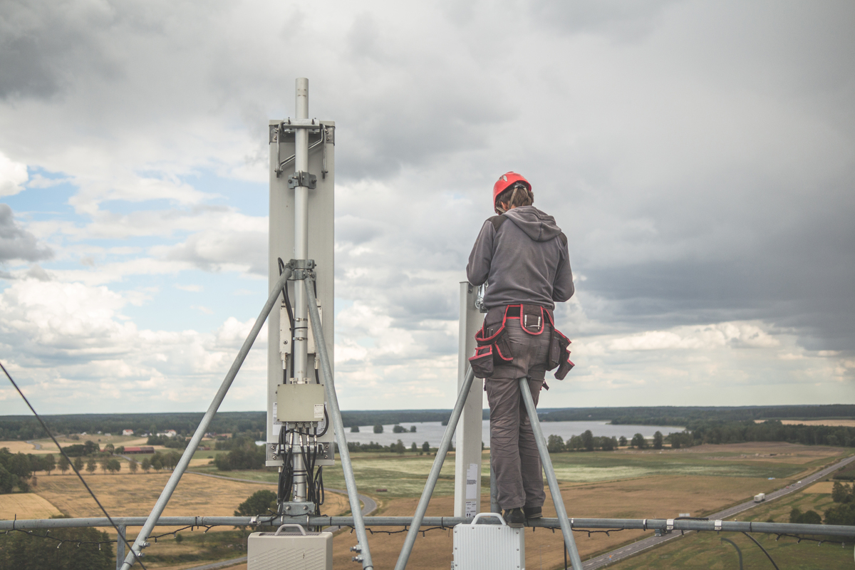 worker climbing tower