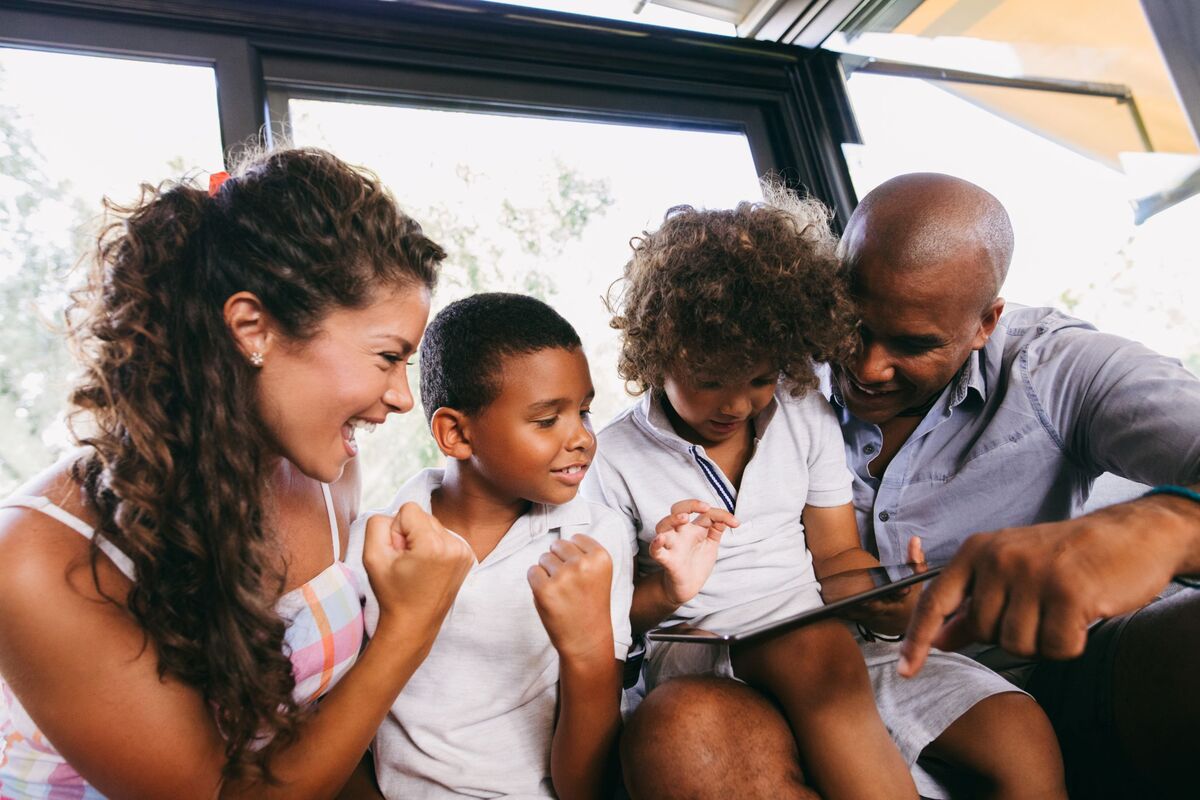 family playing together on tablet